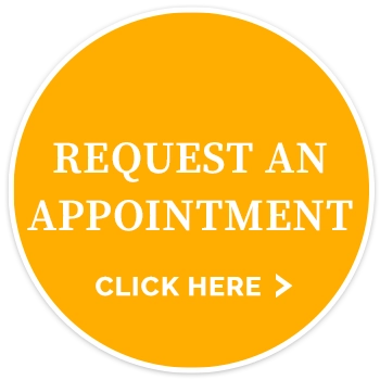 Yellow circular appointment button with the text “REQUEST AN APPOINTMENT” and “CLICK HERE” in white lettering.